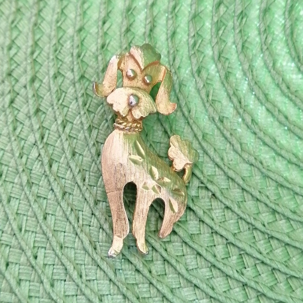 Elegant Gold Toned Poodle Brooch with Intricate Details